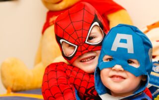 kids in spiderman and Captain America costumes