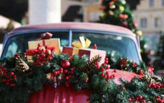 green and red wreath on red car