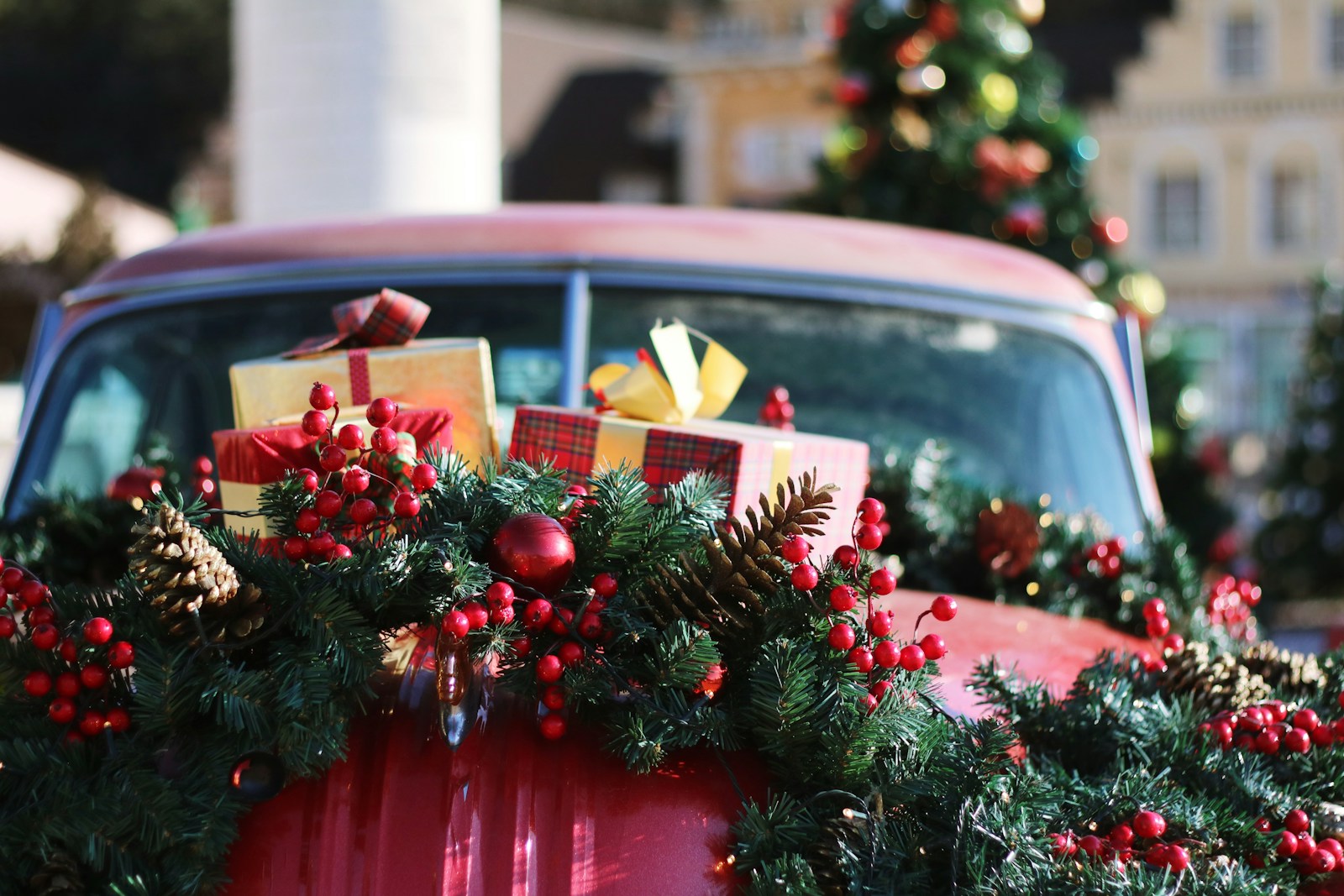 green and red wreath on red car